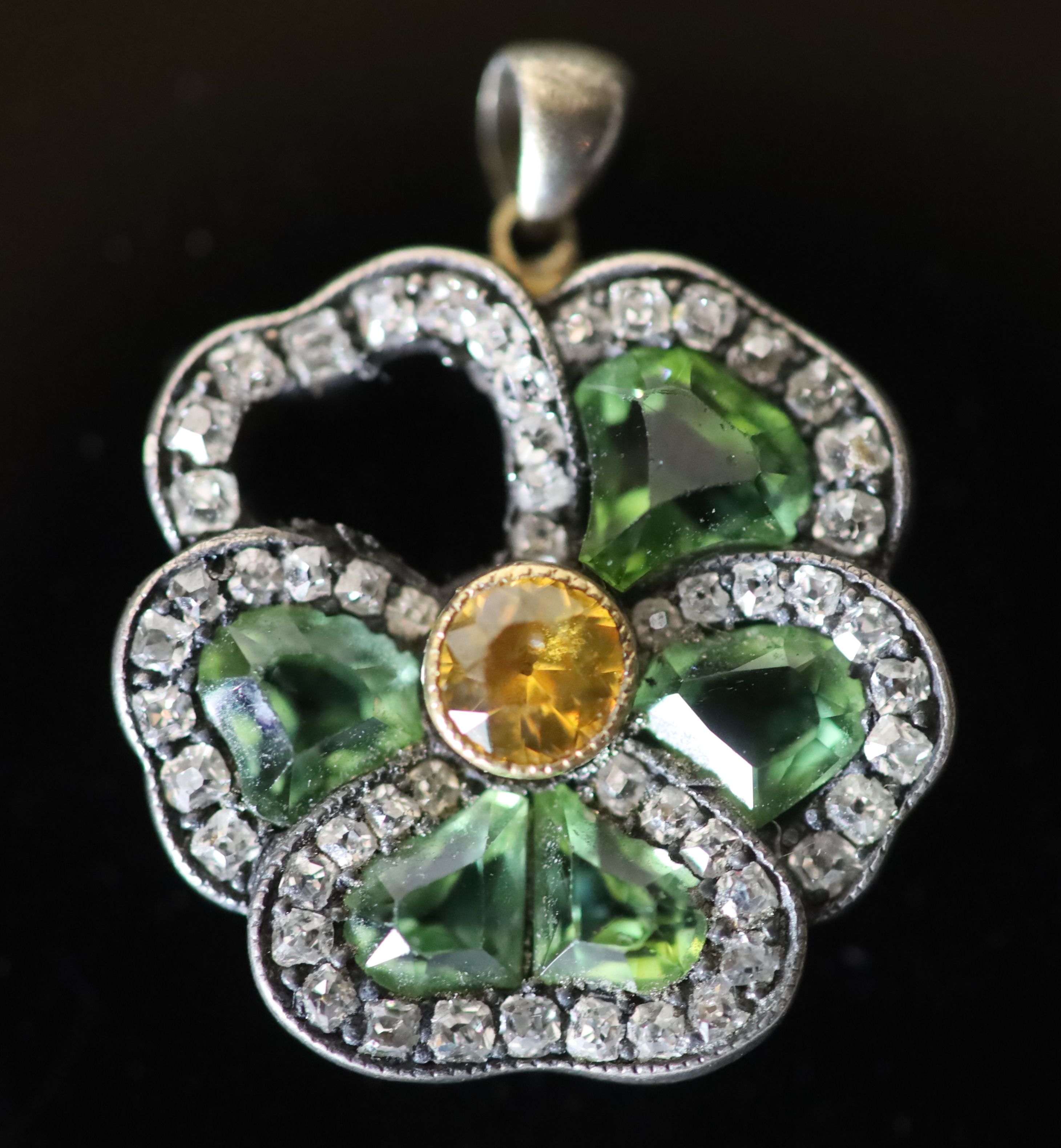 A late Victorian gold and silver, shaped chrysoberyl? and rose cut diamond set pansy cluster pendant (stone missing),